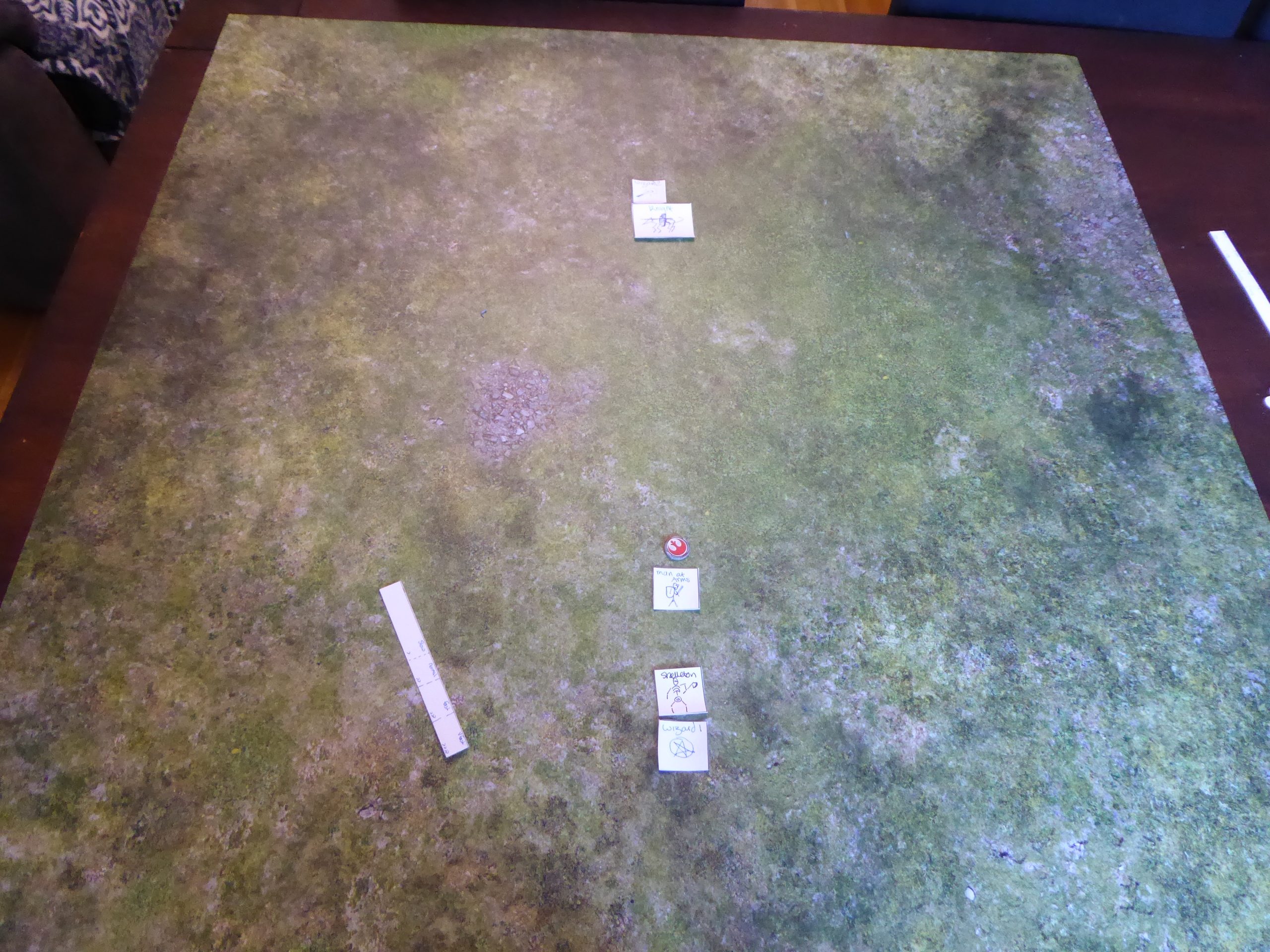 Photo showing the new sized game pieces and a range ruler