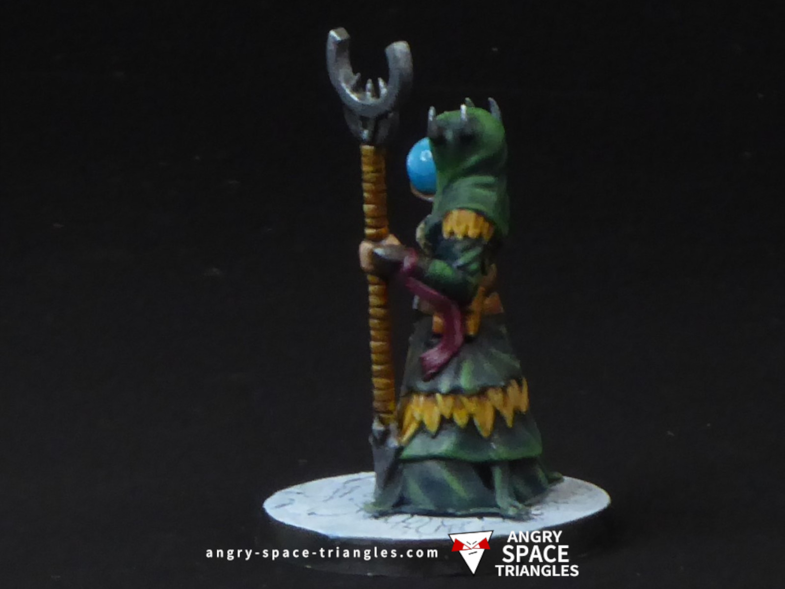 Painted fantasy female sorcerer in green