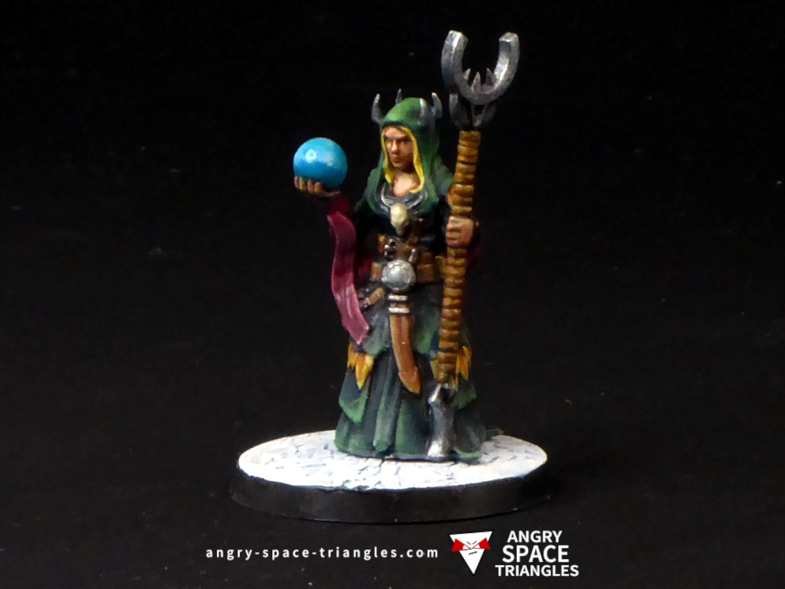 Painted fantasy female sorcerer in green
