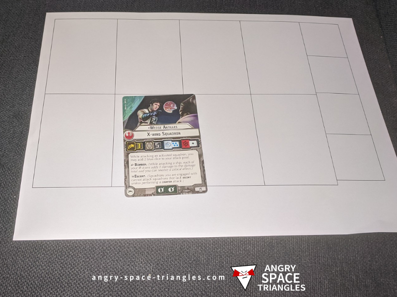 Photo of a paper template and a Star Wars Armada game card for making spell cards